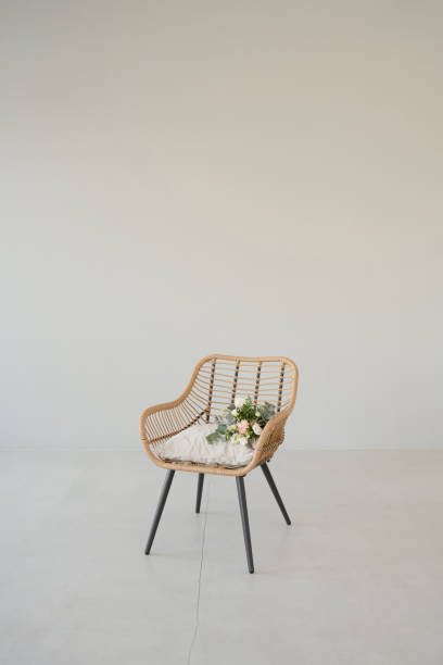 istock A chair with flowers against the wall 1427493422