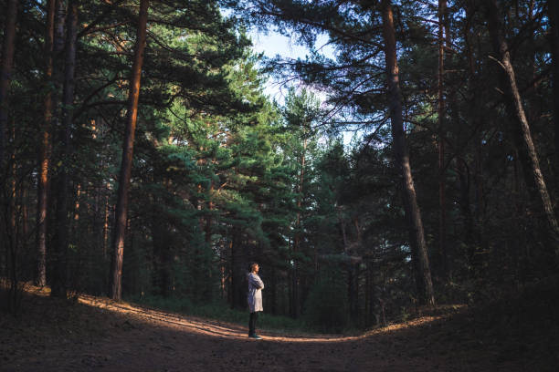 istock young woman in a pine forest 1427493490