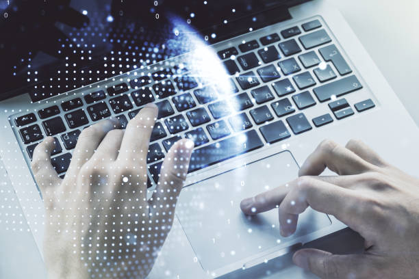 istock Abstract creative digital world map and hands typing on laptop on background, globalization concept. Multiexposure 1427494134