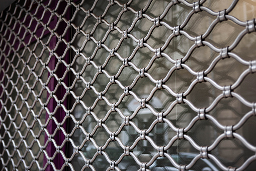 Iron curtain on the facade of a closed shop