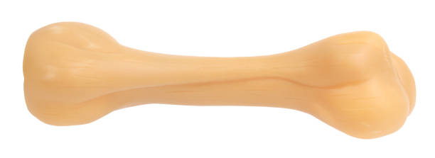 istock Dog bone beige pet toy perfect isolated on white background 1427498304