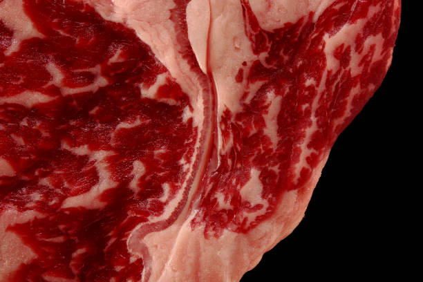 Close up of marbled beef steak isolated on black