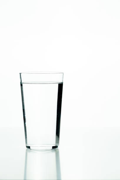 istock Glass beaker filled with water on a white background 1427503402