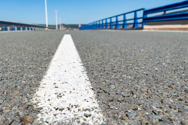 istock median closeup on an empty asphalt road 1427504398