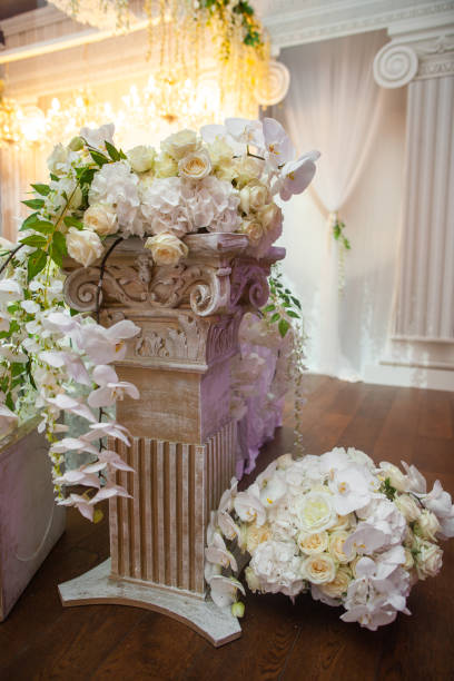 istock Delicate flowers on a column at a wedding 1427504869