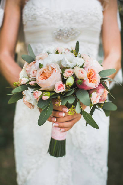 istock Bright wedding bouquet in hands of the bride 1427505036