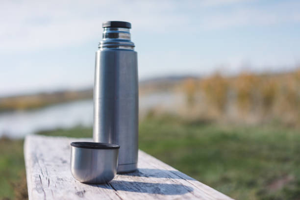 istock pouring tea near by a lake 1427505038
