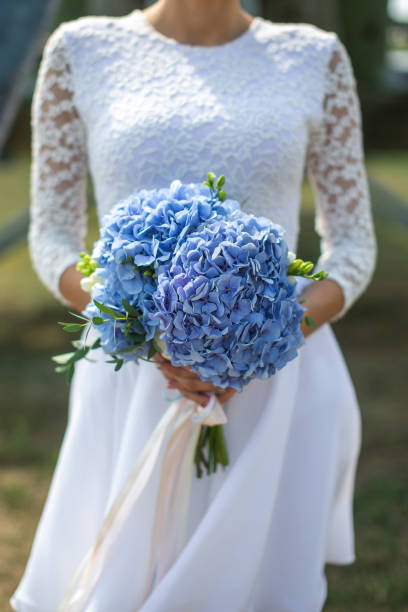 istock Bright wedding bouquet in hands of the bride 1427505235