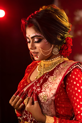 Traditional Indian Bridal Look by an Beautiful Model with High End Makeup,Costume,Jewellery beautiful Indian Model Stock Photo