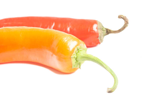 Red Chili Pepper whole and sliced on slate platter