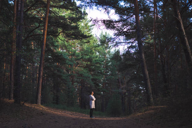 istock young woman in a pine forest 1427506355