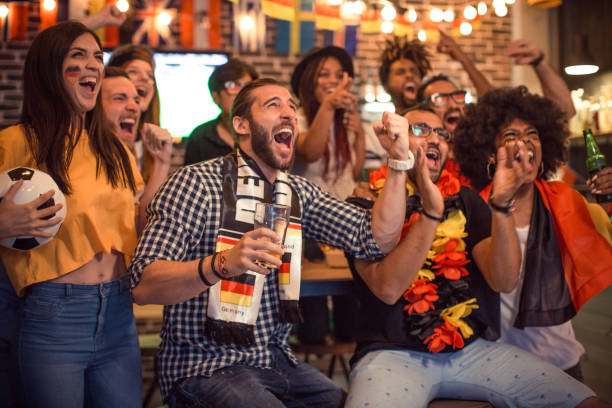 istock Soccer fans cheering at bar 1427508479