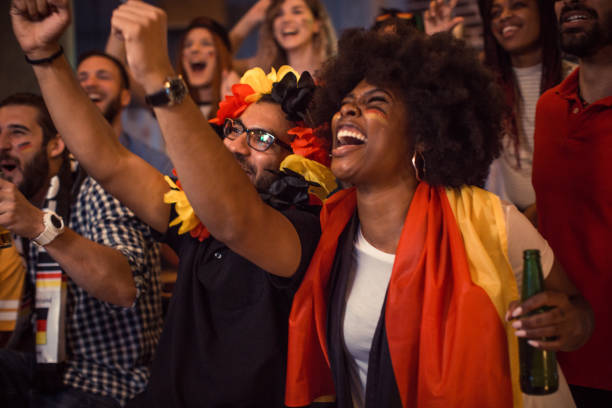 istock Soccer fans cheering at bar 1427508504