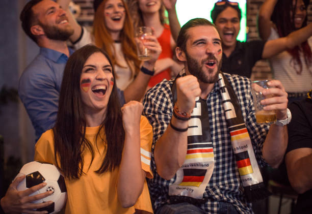istock Soccer fans cheering at bar 1427508515