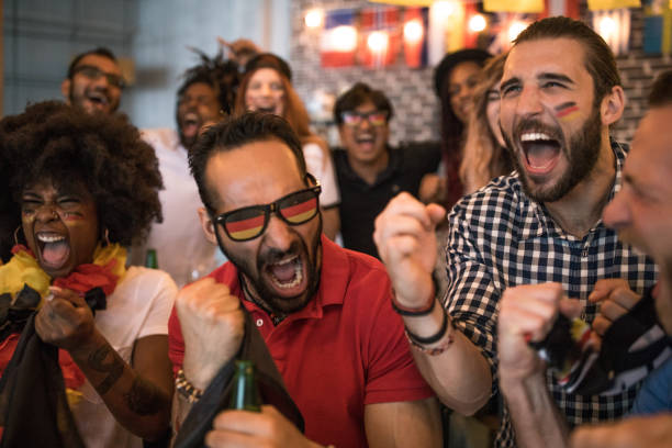 istock Soccer fans cheering at bar 1427508601