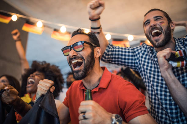 istock Soccer fans cheering at bar 1427508630