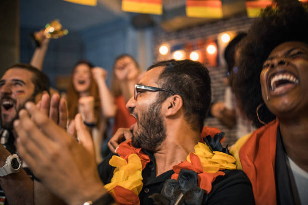 istock Soccer fans cheering at bar 1427508762