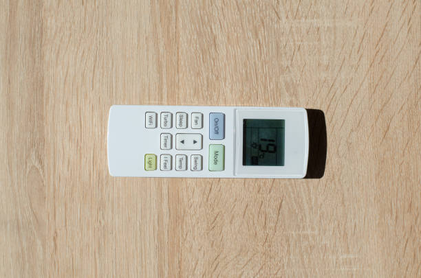 istock Modern remote control of air conditioner isolated on white. Top view. 1427514336