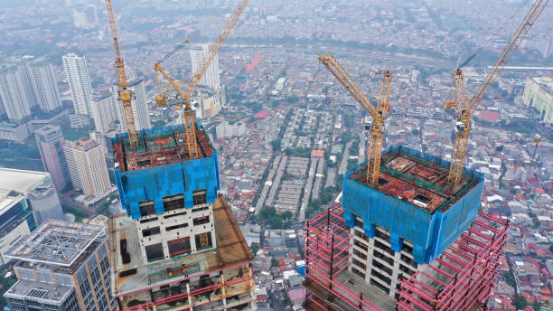 istock Aerial view near and around new constructions building development site. Modern architecture of skyscrapers and high rise housing. Real Estate concept. Empty working area, cranes and heavy machinery 1427519095