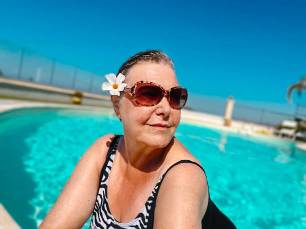 Beautiful confident senior woman on vacation stock photo