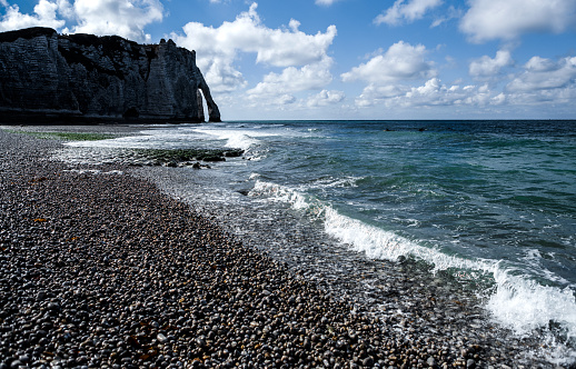 Etretat pebble beach and its cliffs