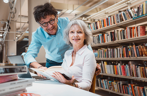 Portrait of two people in the library