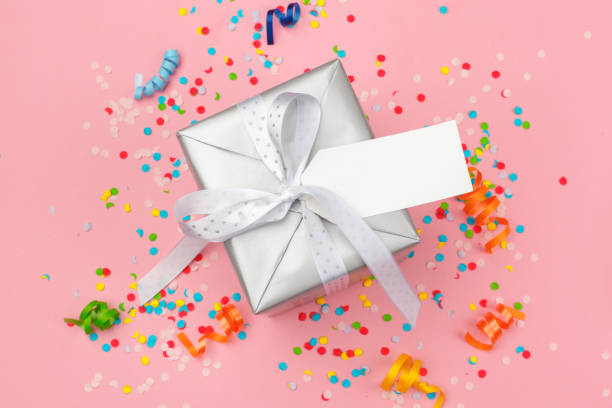istock gift box with various party confetti, streamers and decoration 1427526942