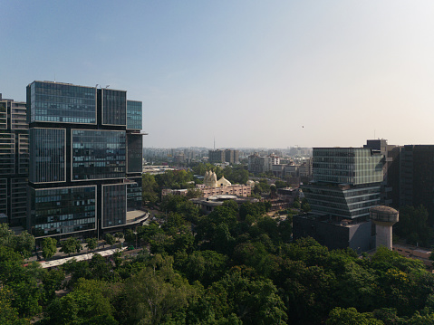 Highly detailed abstract wide angle aerial view of buildings in the financial district. Ultra modern contemporary buildings with unique architecture. Shot on DJI Mini 3 Pro. Image is ideal for background.