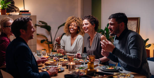 istock Group Of Friends Having Fun During A Dinner Celebration 1427534674