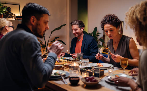 istock Group Of Friends Having Fun During A Dinner Celebration 1427534722