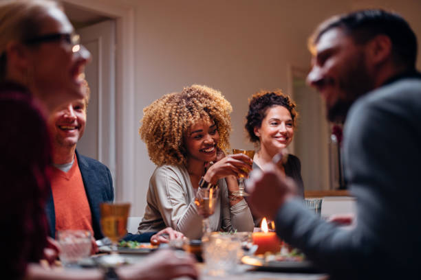 istock Group Of Friends Having Fun During A Dinner Celebration 1427534783