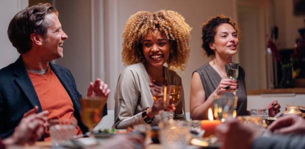 istock Group Of Friends Having Fun During A Dinner Celebration 1427534814