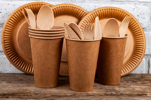 istock Disposable paper biodegradable cups, plates, spoons, forks and knives 1427539285