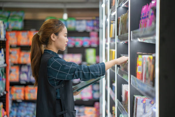 istock supermarket clerk using apps on a digital tablet, innovative technology and work concept, a young female supervisor with tablet pc in the mall. 1427539373