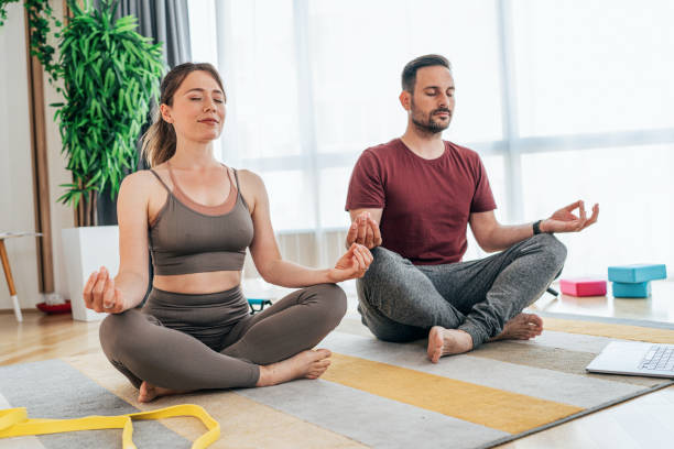 istock Couple doing yoga together 1427539576
