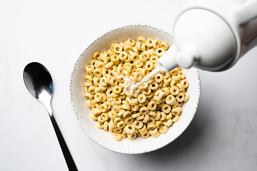 Cereals for breakfast over white marble table