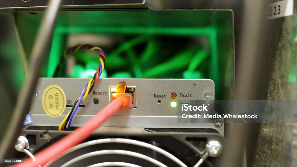 Rear view of an antminer device, bitcoin mining hardware. Stock footage. Close up of professional equipment for digital currency mining. Rear view of an antminer device, bitcoin mining hardware. Close up of professional equipment for digital currency mining. Bitcoin Stock Photo