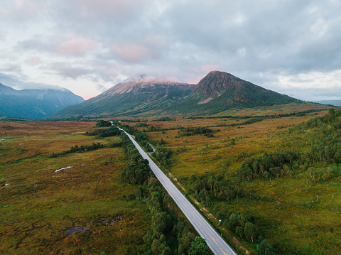 Scenic aerial view of  winding road through Norwegian highlands  in summer