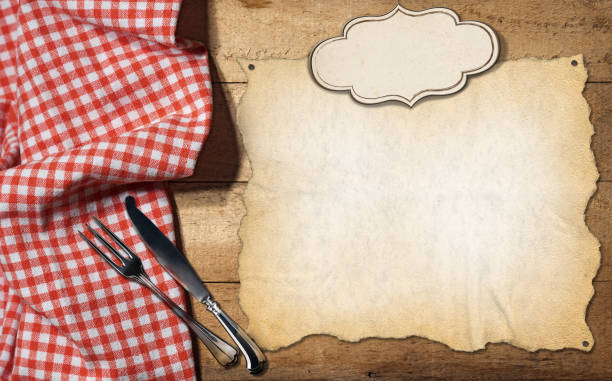 istock Wooden Table with Tablecloth and Cutlery - Empty Parchment and Label 1427543663