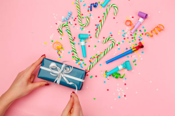 istock gift box with various party confetti, streamers and decoration 1427547517
