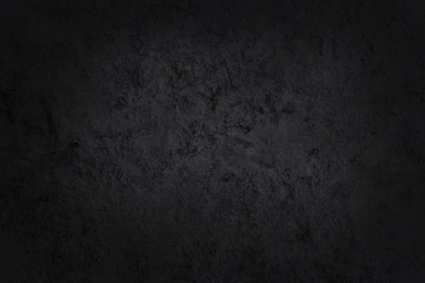 istock Dark gray black slate stone wall texture background in natural pattern for decorative interior and exterior. 1427547924