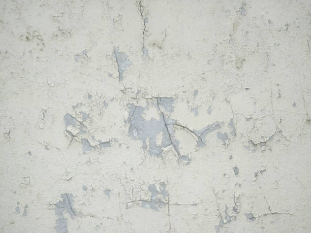 istock Cracked white concrete wall Suitable for your designs and work surfaces. 1427549267