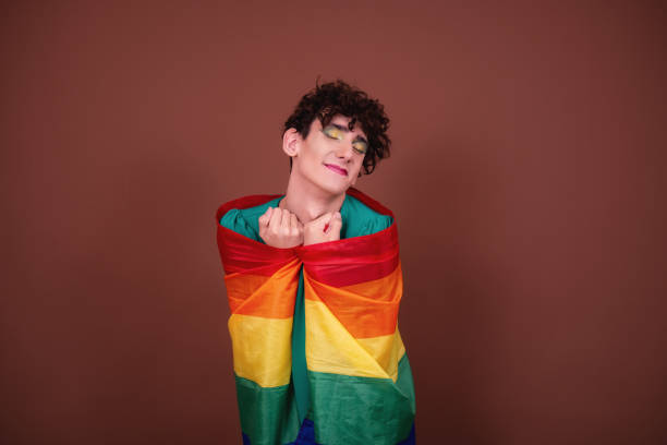 istock Young attractive guy in make-up posing in the studio. 1427551041