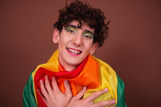 istock Young attractive guy in make-up posing in the studio. 1427551116