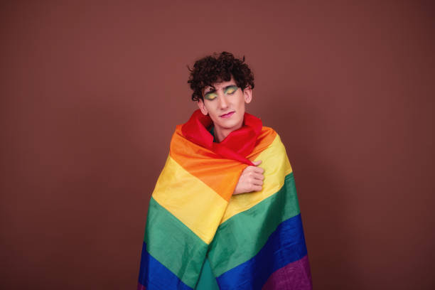 istock Young attractive guy in make-up posing in the studio. 1427551801