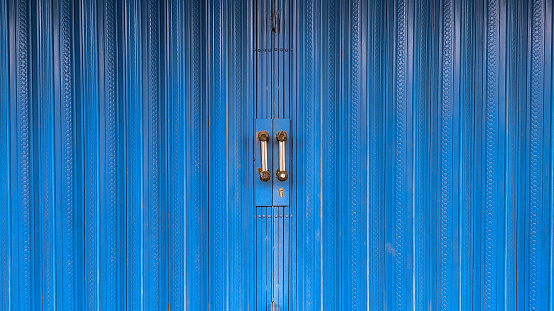 Rolling door made of iron which is painted blue