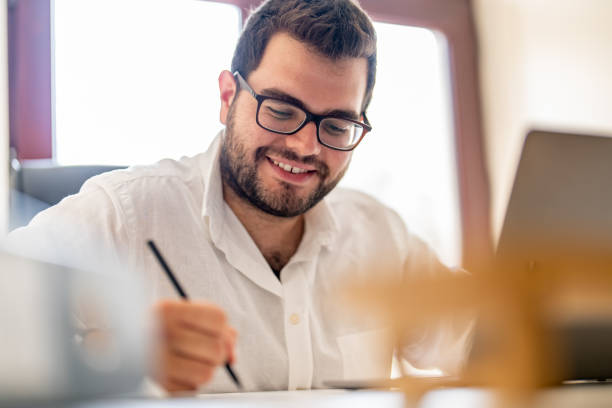 istock Young businessman working on laptop at his office 1427555349