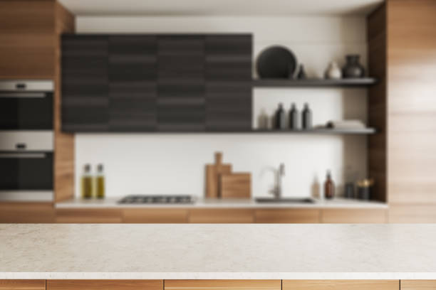 istock Empty countertop on background of wooden kitchen interior. Mockup 1427555366