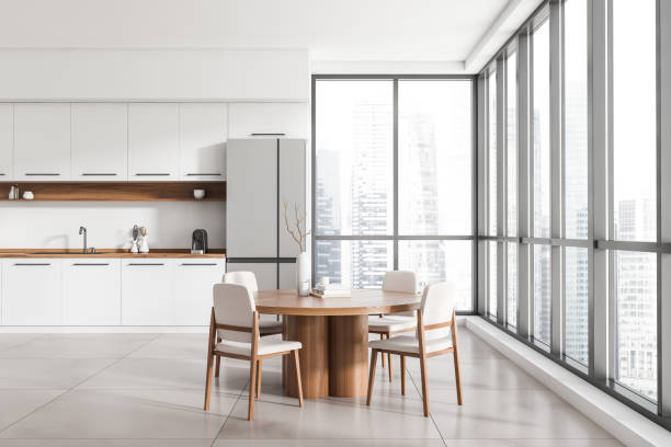 istock Kitchen interior with eating table and chairs, decoration and panoramic window 1427558741