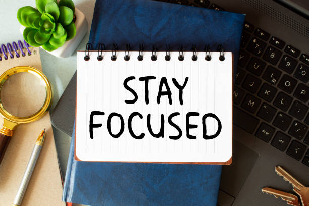 istock STAY FOCUSED man hand notebook and other office equipment such as computer keyboard 1427567113